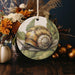 a decorative plate with a snail painted on it