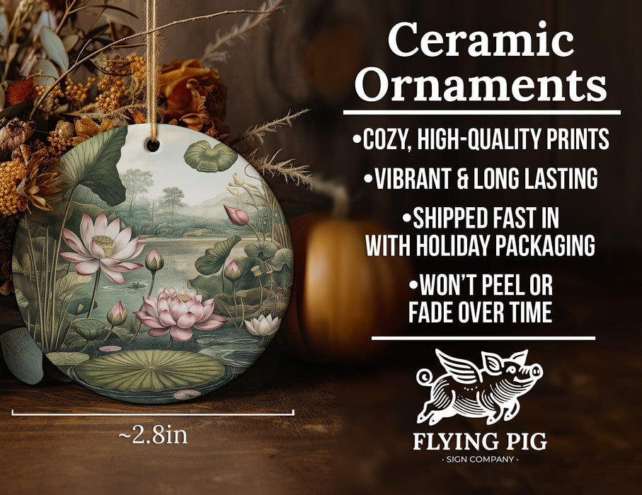 a ceramic ornament with a painting of water lillies