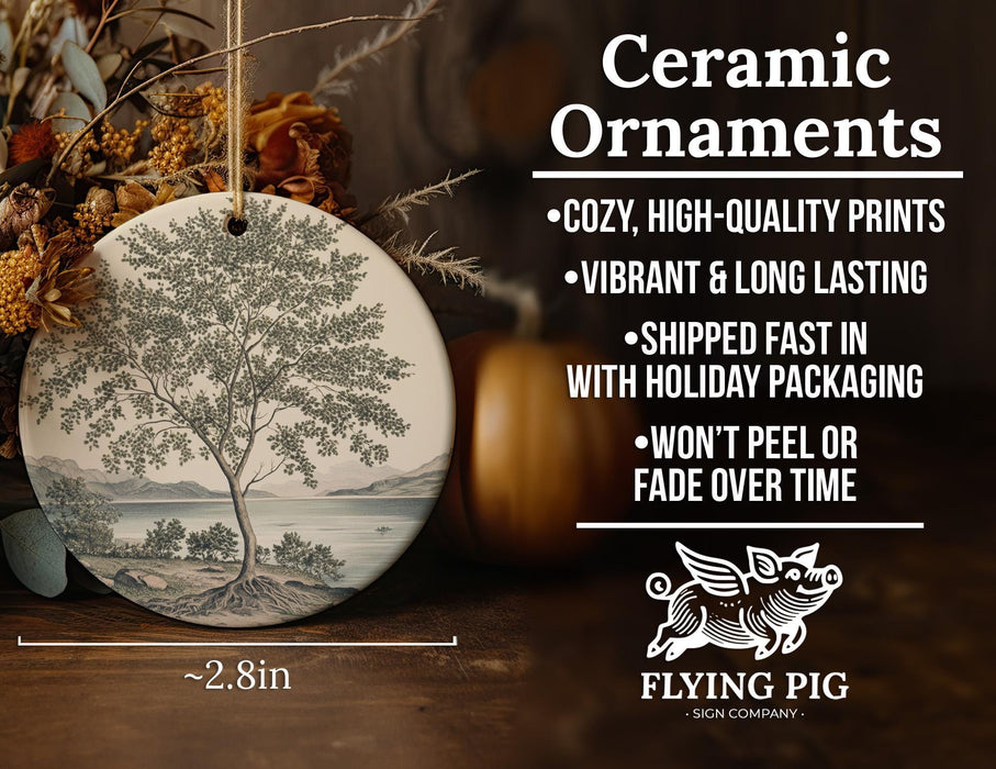 a ceramic ornament with a tree on it