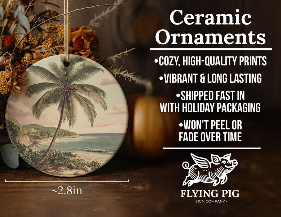 a ceramic ornament with a painting of a palm tree