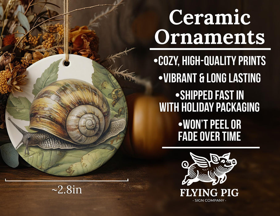 a ceramic ornament with a picture of a snail on it