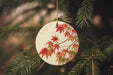 a ceramic ornament hanging from a christmas tree