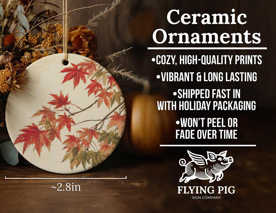 a ceramic ornament with autumn leaves on it