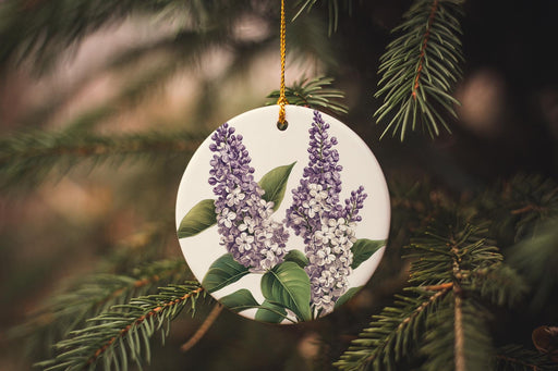 a ceramic ornament hanging from a tree