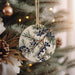 a ceramic ornament hanging from a christmas tree