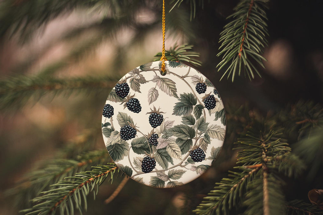 a christmas ornament hanging from a pine tree