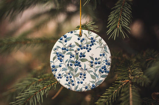 a ceramic ornament hanging from a christmas tree