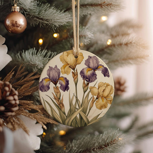 a ceramic ornament hanging from a christmas tree