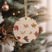 a wooden ornament hanging from a christmas tree