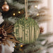 a christmas ornament hanging from a christmas tree