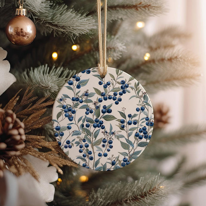 a ceramic ornament hanging from a christmas tree