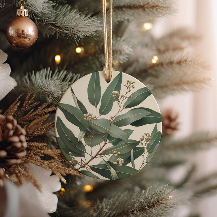a ceramic ornament hanging from a christmas tree