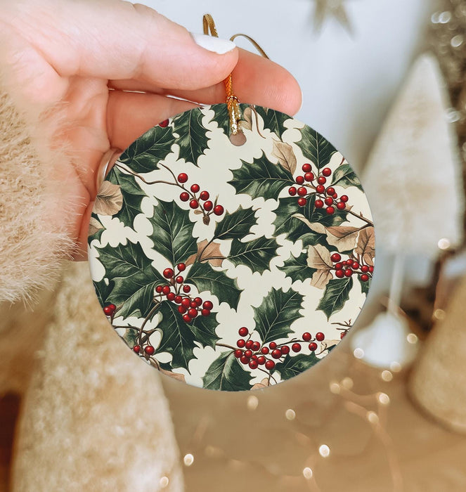 a person holding a christmas ornament in their hand