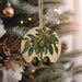 a christmas ornament hanging from a christmas tree