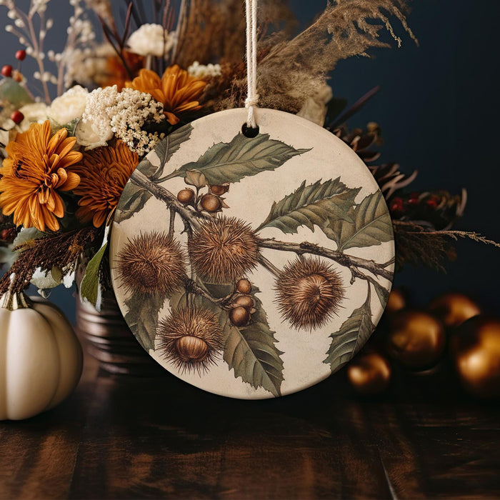 a ceramic ornament with flowers and leaves on a table