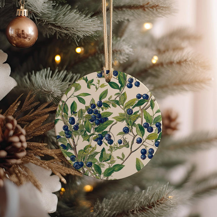 a ceramic ornament hanging from a christmas tree