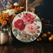 a ceramic ornament decorated with flowers and leaves