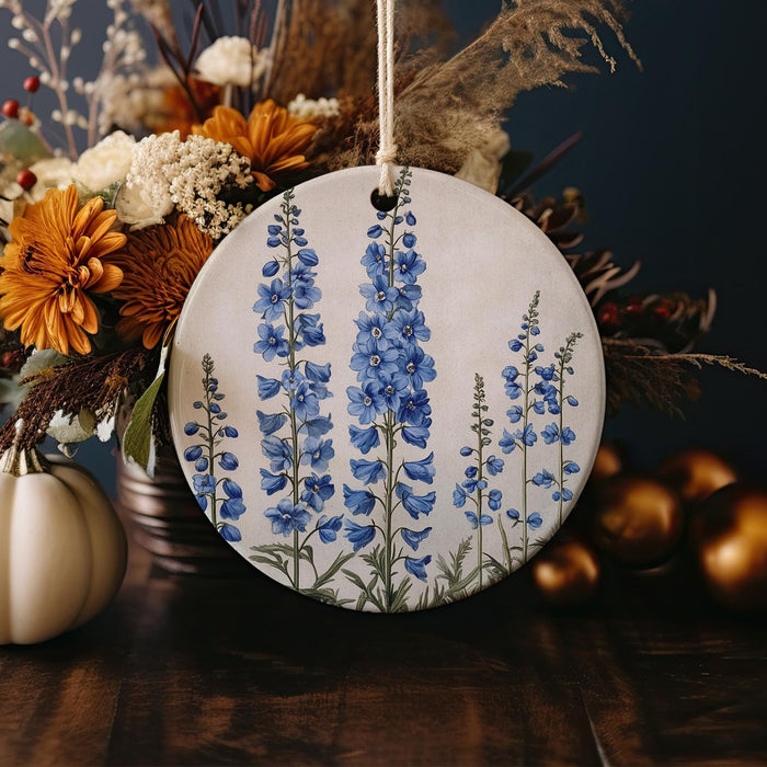 a blue and white floral ornament sitting on a table