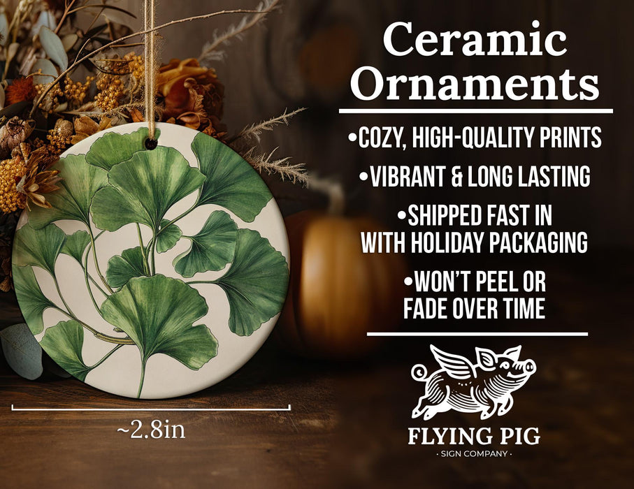 a ceramic ornament with a green leaf design