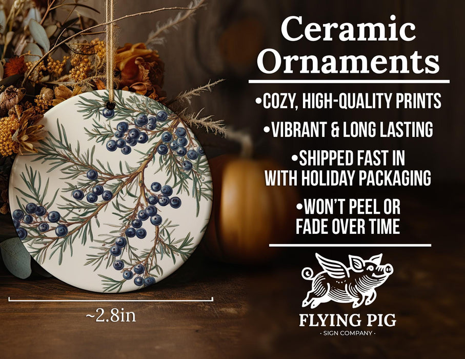 a ceramic ornament with blue berries on it