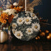 a vase filled with lots of flowers on top of a table