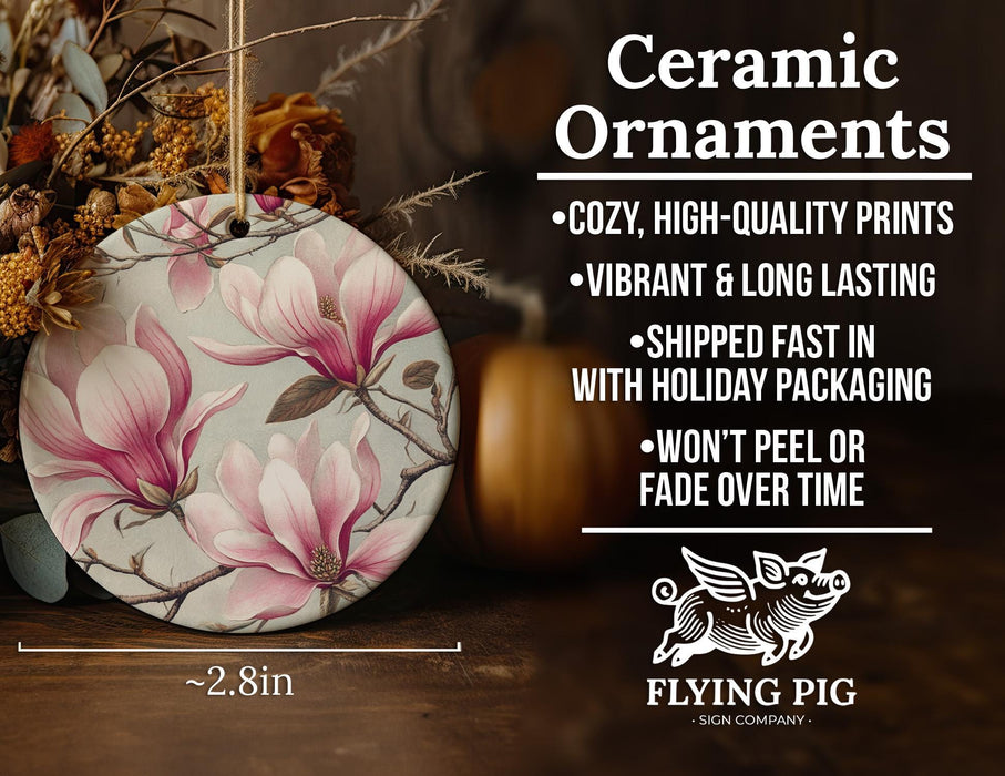 a ceramic ornament with pink flowers on it