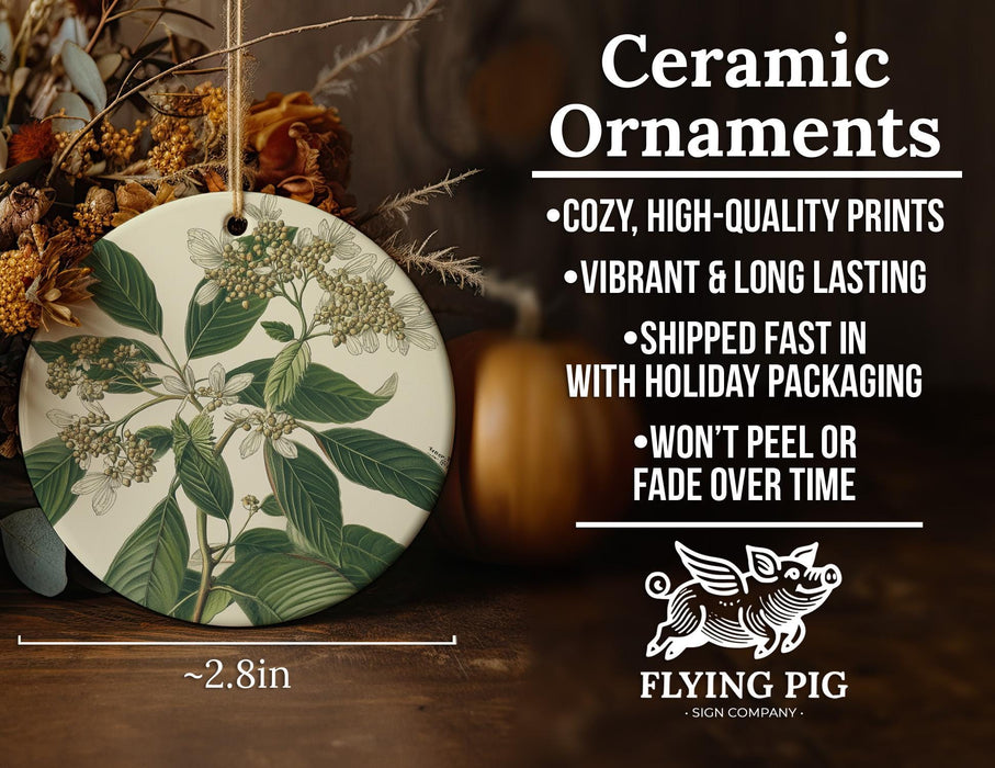 a ceramic ornament with flowers and leaves on it
