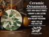 a ceramic ornament with flowers and leaves on it
