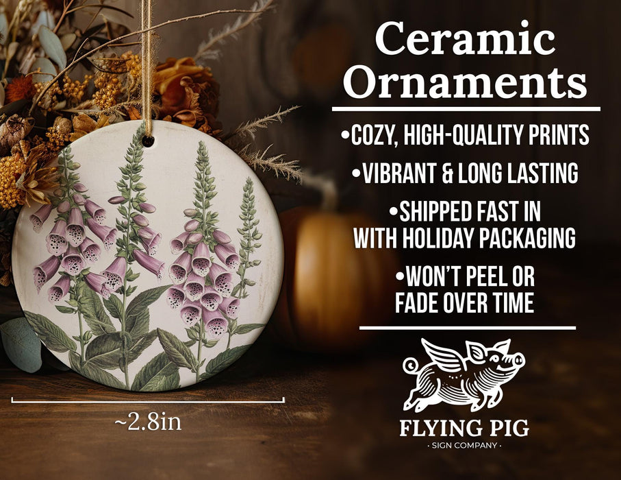 a ceramic ornament with purple flowers on it