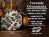 a ceramic ornament with holly and berries on it