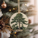 a christmas ornament hanging from a christmas tree