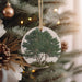 a christmas ornament hanging from a christmas tree