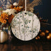 a white plate with a tree design on it