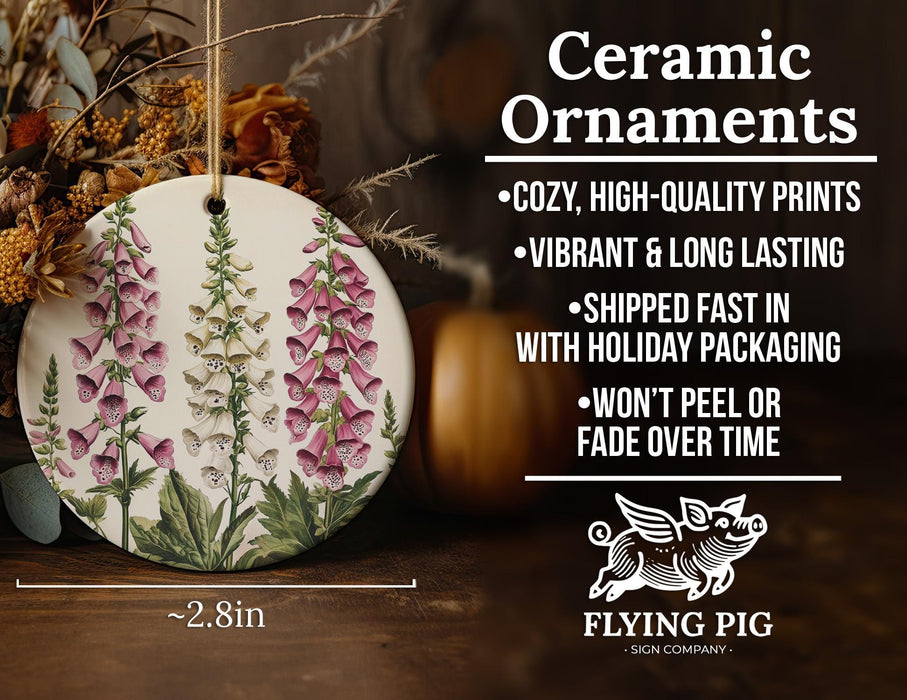 a ceramic ornament with pink flowers on it