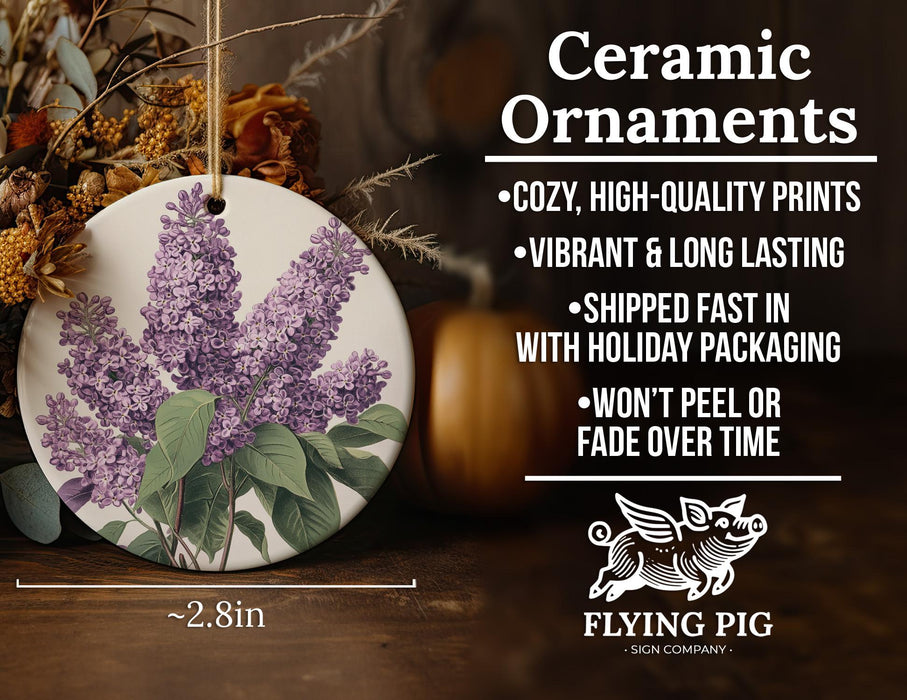 a ceramic ornament with purple flowers on it