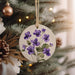 a ceramic ornament hanging from a christmas tree