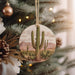a christmas ornament hanging from a christmas tree