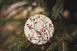 a ceramic ornament hanging from a christmas tree