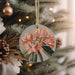 a christmas ornament hanging from a christmas tree