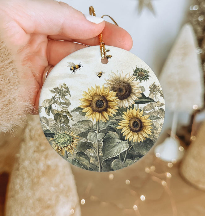 a person holding a sunflower ornament in their hand