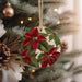 a christmas ornament hanging from a christmas tree
