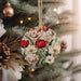 a christmas ornament hanging from a christmas tree