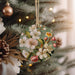 a christmas ornament hanging from a christmas tree