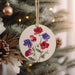 a christmas ornament hanging from a christmas tree