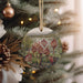 a christmas ornament hanging from a christmas tree