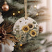 a christmas ornament hanging from a christmas tree