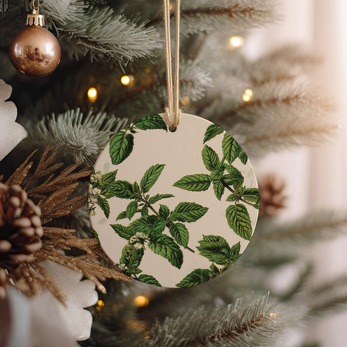a ceramic ornament hanging from a christmas tree
