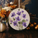 a white plate with purple flowers on it