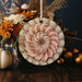 a picture of a flower in a vase on a table