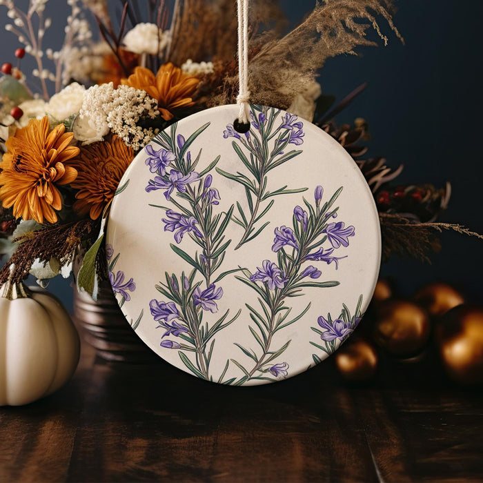a ceramic ornament decorated with flowers and leaves